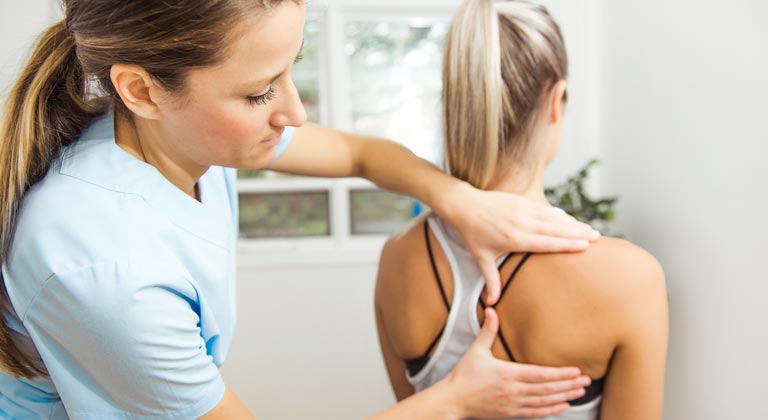 physical therapist working with patient