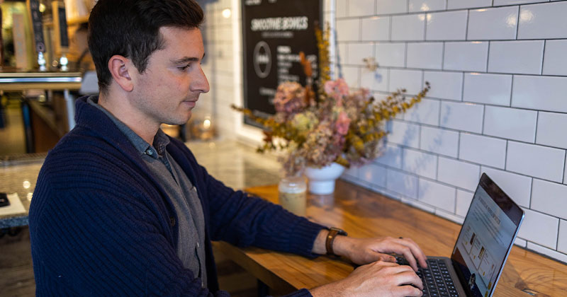 man on laptop at office