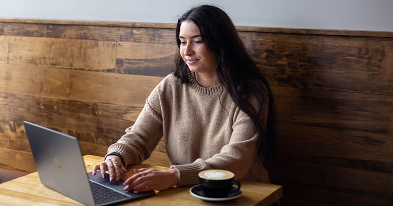 woman on laptop at coffee house